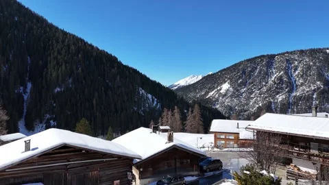 Leaving a snowy mountain chalet for an alpine valley view Stock-Footage 330426504