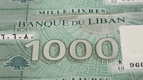 Lebanese 1000 pound notes tracking. Slider shot. Low angle, macro. 4K Video stock 125946618
