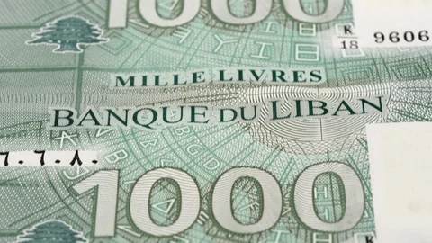 Lebanese 1000 pound notes tracking, fast moving. Dolly shot. Low angle. 4K Stock-Footage 125954234