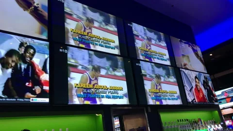 Lebron James Passes Kareem As NBA Leading Scorer on Tv's in Sports Bar Stock Footage 232622246