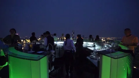 Lebua Rooftop Sky Bar at night with Bartenders serving Drinks, Thailand Stock Footage 171463042