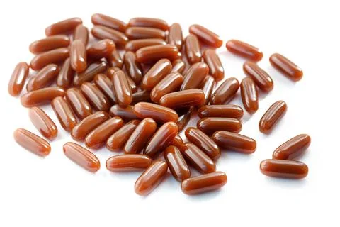 Lecithin in brown capsules close up. Stock Photos