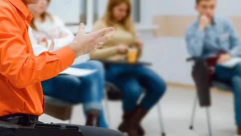 Lecturer conducts a lecture, training. Stock Photos