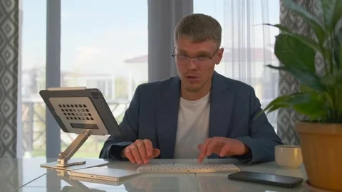 Lecturer conducts webinar, types code, switches slides. Video stock 299892159