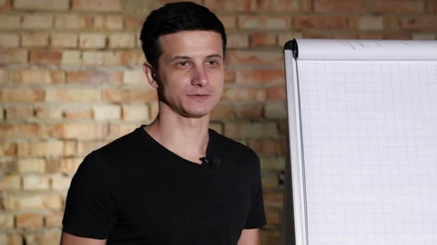 Lecturer Next to Board Explaining Material in 4K 库存影片 92937116