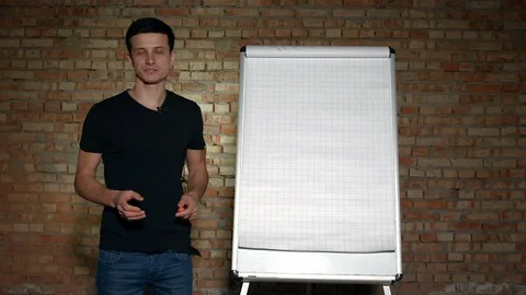 Lecturer Taking Marker Next to Board Explaining Material in 4K Vidéo 92937145