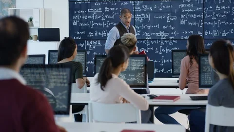 Lecturer teaching physics to students of engineering in classroom Stock Footage 106683111