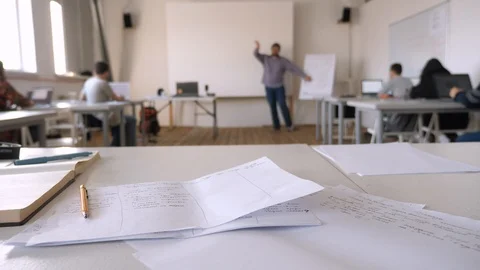 Lecturing process. Teacher with students in classroom. Project presentation 動画素材 103409131