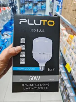 LED Bulb Packaging with Energy Saving Details in Retail Store Stock Photos