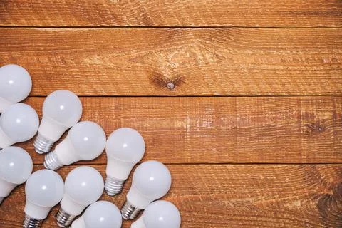 LED bulbs with E27 socket are lying on the table Stock Photos