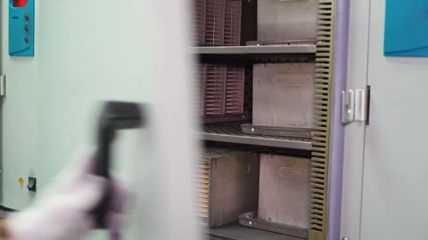 LED burn test in research facility. Close-up of hands of technician inserting Video stock 315761286