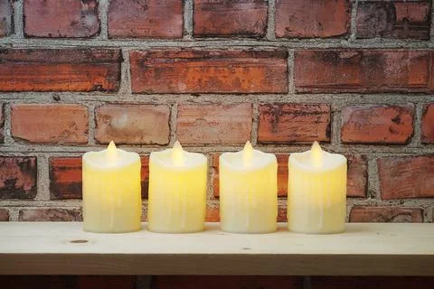 LED Candle Light electronic with space copy on old brick wall background Stock Photos