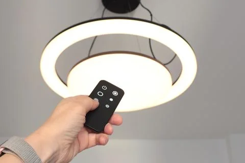LED ceiling light with smart remote control. Energy saving. Clean planet and Stock Photos