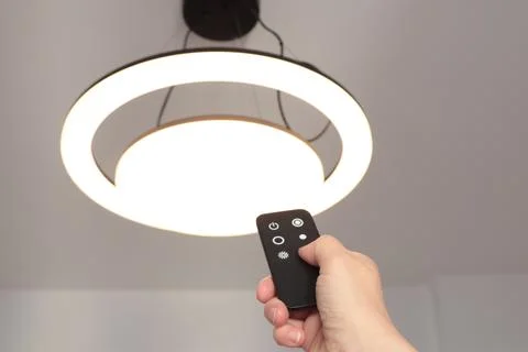 LED ceiling light with smart remote control. Energy saving. Clean planet and Stock Photos