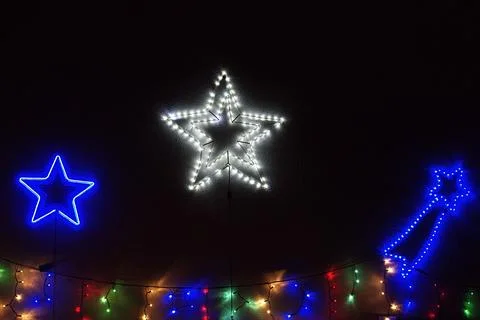 LED Christmas light figure in the shape of multiple stars , illuminated Chr.. Stock Photos