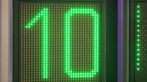 LED clock counts down from 12 to 5 Stock Footage 345379245