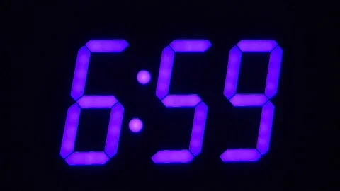 LED clock display with large blue numbers Stock Footage 131435276