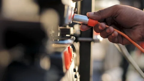 LED Engineer plugging wires Stock Footage 100315097