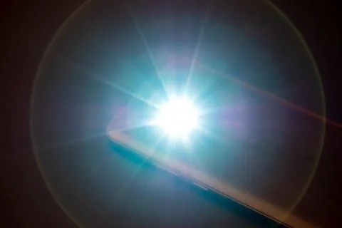 LED Flash or Flashlight of a Smartphone on black background Stock Photos