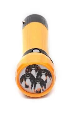 LED flashlight with the ability to recharge from the network on a white backg Stock Photos