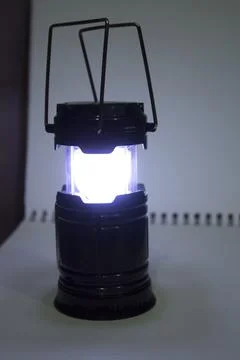 Led flashlight light in the dark background Stock Photos