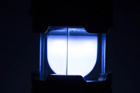 Led flashlight light in the dark background Stock Photos