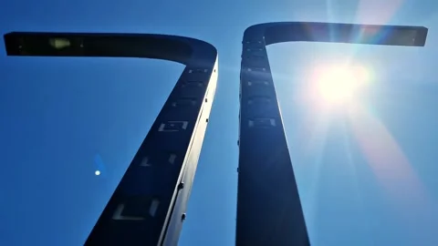 LED Garden Lights with Geometric Patterns Against a Vivid Blue Sky Stock Footage 332156204