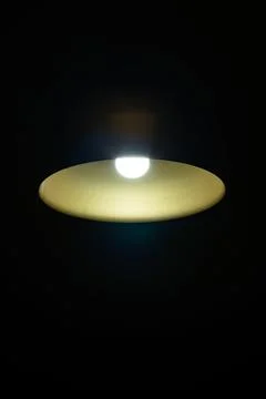 LED lamp in the ceiling on a dark background in the center of the frame Stock Photos
