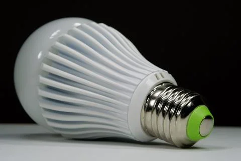 LED lamp with E27 base on black background Stock Photos