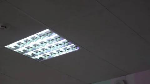 Led lamp on the white ceiling near smoke detector Stock-Footage 76089963