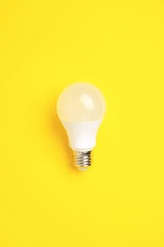 LED lamp on a yellow background. Stock Photos