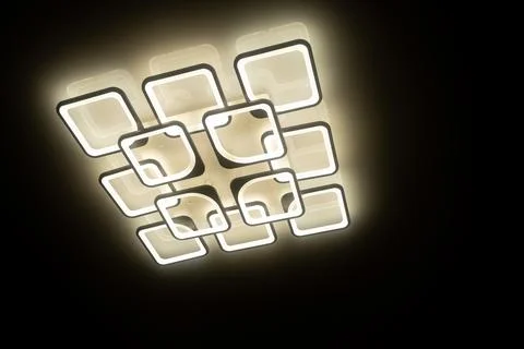 Led lamps built into the ceiling glowing in the dark Stock Illustration