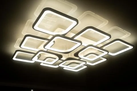 Led lamps built into the ceiling glowing in the dark Stock Illustration