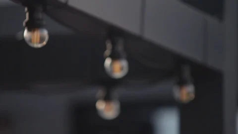 LED lantern bulb string lights with black wire for party patio Stock-Footage 72603125