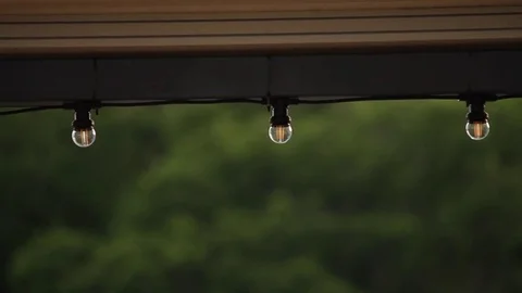 LED lantern bulb string lights with black wire for party yard patio Stock-Footage 72603191