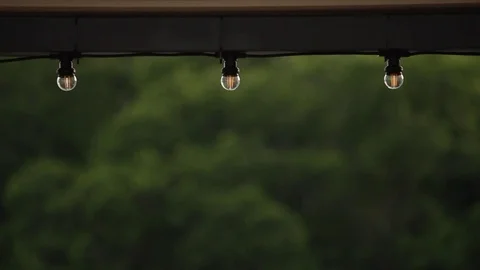 LED lantern bulb string lights with black wire for party yard patio Stock Footage 72603222