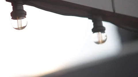 LED lantern bulb string lights with black wire for party yard patio Stock Footage 73668633