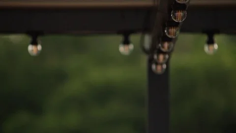 LED lantern bulb string lights with black wire for party yard patio Stock Footage 73668676