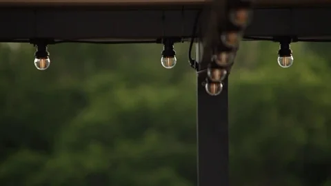 LED lantern bulb string lights with black wire for party yard patio Stock-Footage 73668783