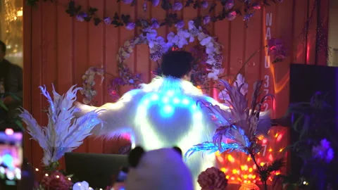 Led light on back of dj man. Creative night club party with cheery fun artist. Stock Footage 165326504