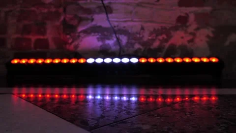LED light bar wall washer glowing on a brick wall background Stock Footage 345638723
