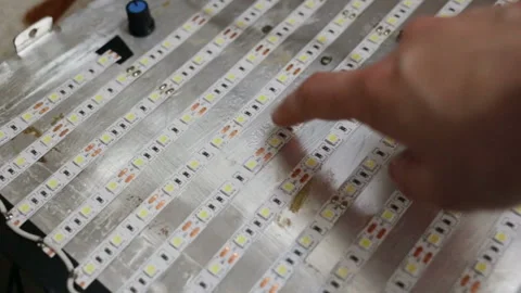 Led light bulbs light up due to the electrical conductivity of the skin. The fin Stock Footage 108653478