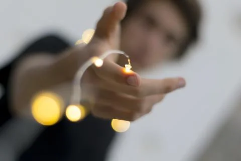 LED Light string cover arm of young man 스톡 사진