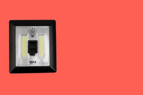 LED Light switch isolated on red background 库存照片