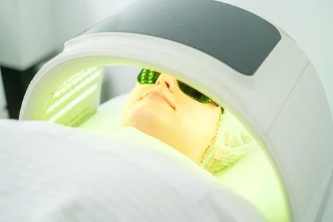 LED light therapy session for acne treatment in a calming spa environment Stock Photos