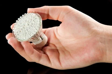 Led lightbulb in hand Stock Photos