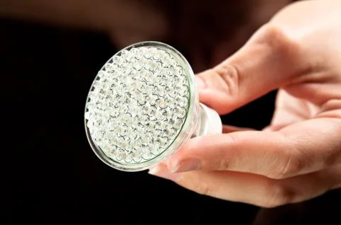 Led lightbulb in hand Stock Photos