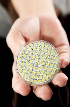 Led lightbulb in hand Stock Photos