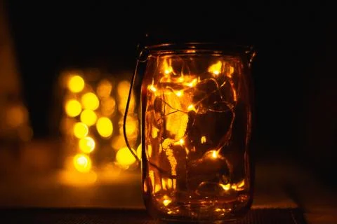 LED lights in a mason jar at night Stock Photos