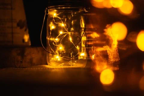 LED lights in a mason jar at night Stock Photos